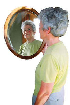 Photograph of Earla Sue Looking into a Mirror