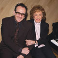 Photograph of Marian McPartland with Elvis Costello