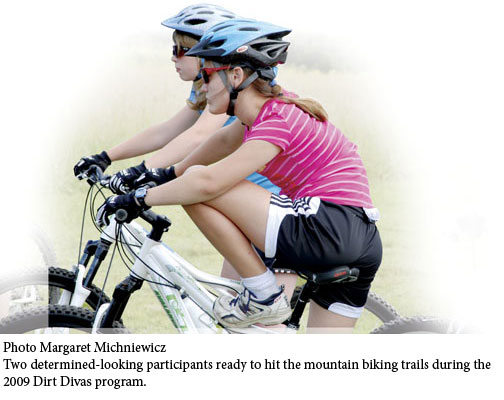 Two girls mountain biking