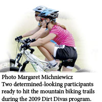 Two girls mountain biking